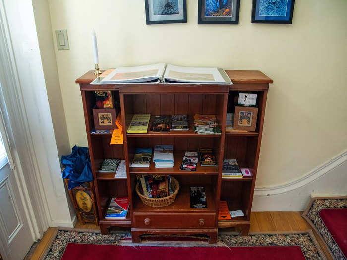 A small wooden bookshelf was set up to the left of the front door. It was well stocked with brochures and maps for guests trying to navigate their stay in Salem.