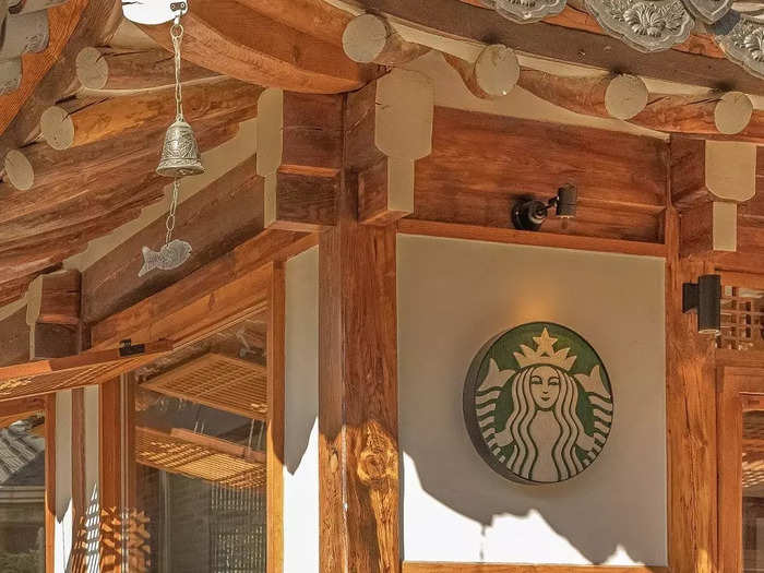 The historic space was adapted into a modern Starbucks, divided into two distinct spaces.