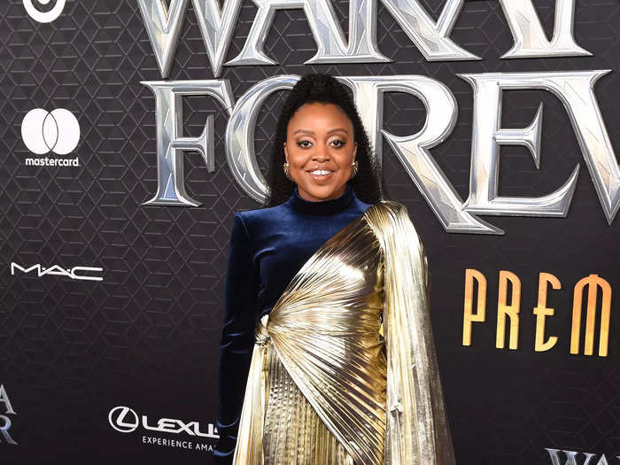 "Abbott Elementary" star Quinta Brunson walked the carpet in a gold and blue dress.