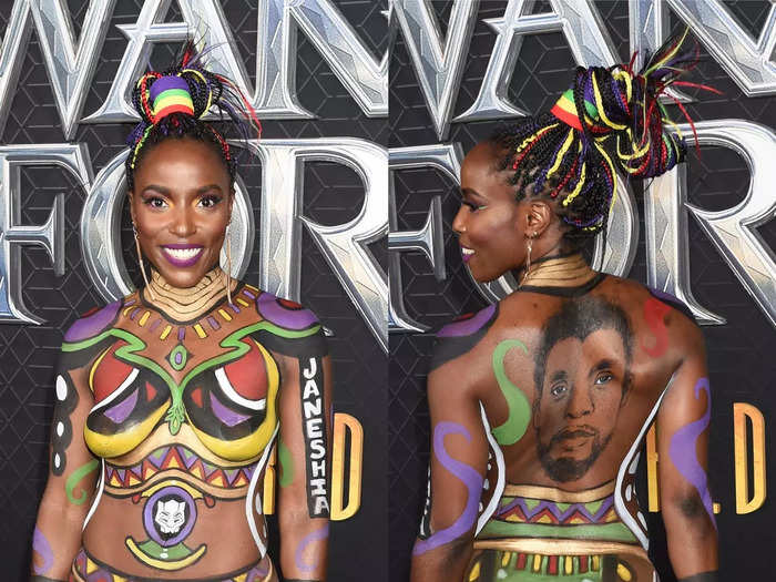 Dora Milaje actor Janeshia Adams-Ginyard also walked the carpet wearing body paint that symbolizes the film and pays tribute to Boseman.