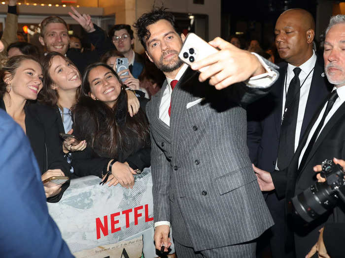 Cavill was among the stars who stopped to take selfies with fans who had come out for the event.