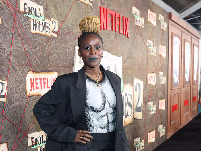 Sharon Duncan-Brewster, who makes her debut as Ms. Troy in the sequel, walked the red carpet in a black suit and eyecatching shirt.