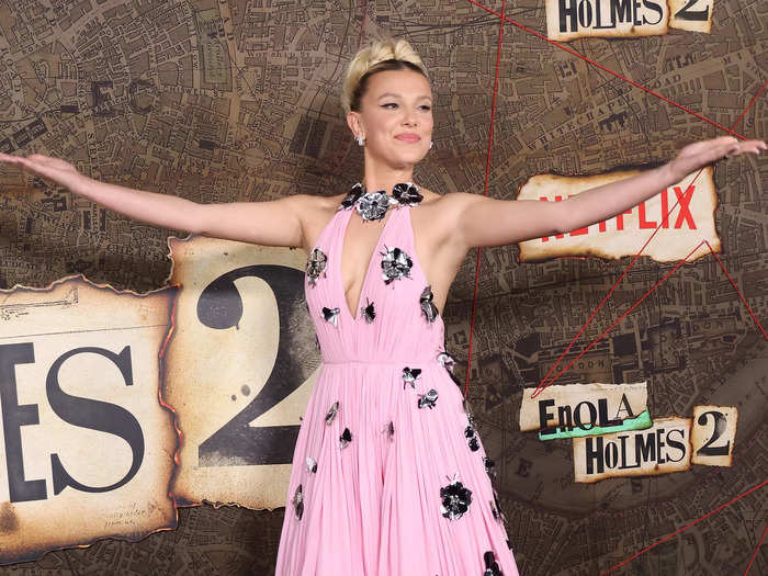 Millie Bobby Brown struck a pose as she stepped out onto the red carpet to celebrate the release of "Enola Holmes 2."