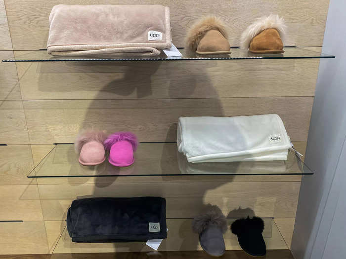 The shelves nearby had fluffy slippers and blankets on display.