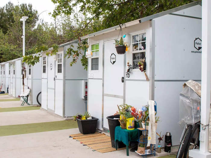 Over the last several years, tiny home "villages" that shelter people until they can find long-term housing have been popping up across the US with the help of government funding and nonprofits.