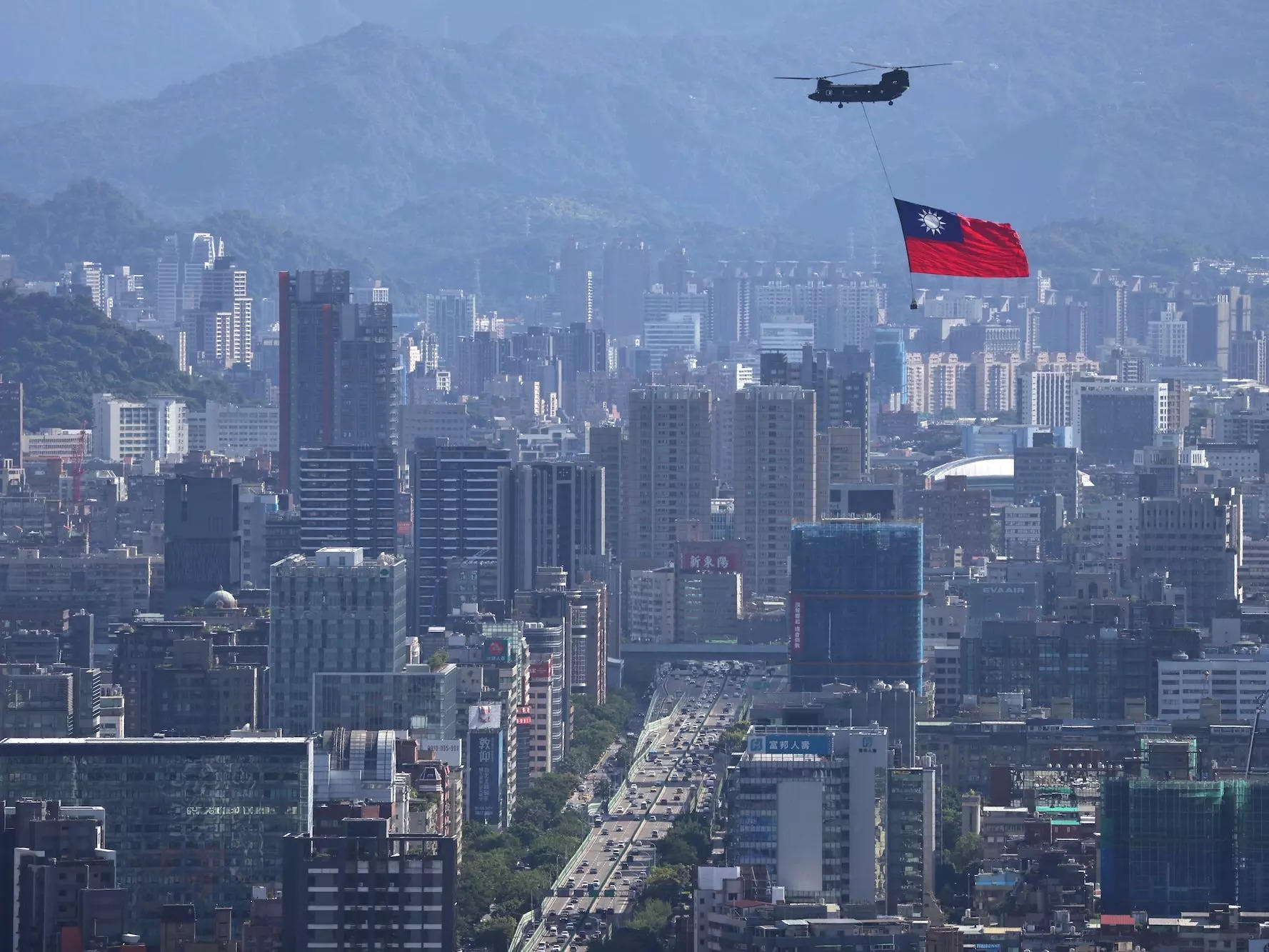 Chinook helicopter carries Taiwan flag over Taipei