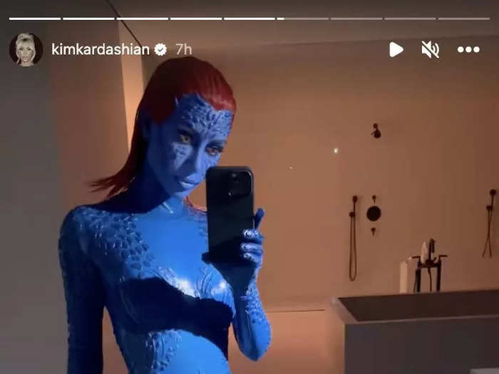 Kim celebrated Halloween as Mystique from the "X-Men" comic books in a skin-tight blue suit and fiery red hair.