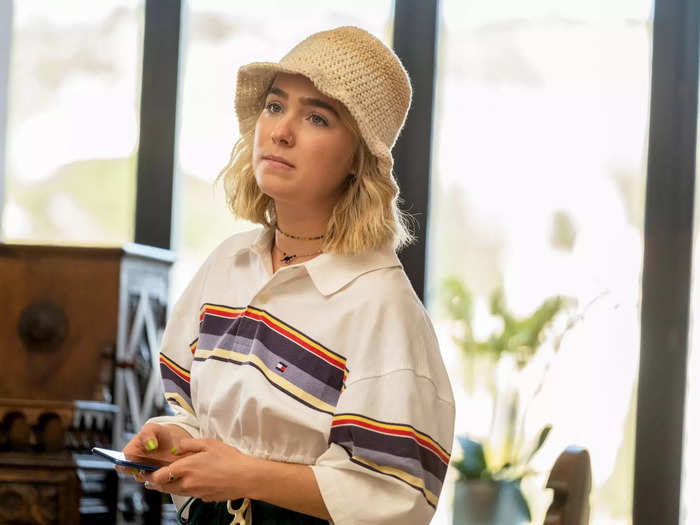 Haley Lu Richardson is introduced as Portia, a personal assistant traveling with her boss Tanya (Jennifer Coolidge).