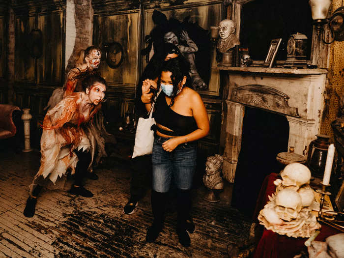 As I entered the haunted house, a bloody character told us the rules — no cellphones, no touching the actors — and sent us on our way.