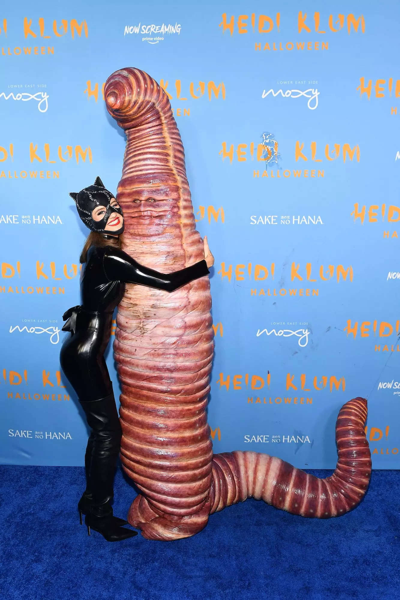 Leni Klum hugs Heidi Klum, who was dressed as a giant worm for Halloween.