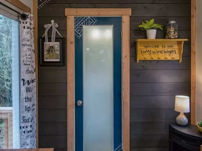 I immediately went to check out the bathroom. This was a small room with a locking door at one end of the tiny house.