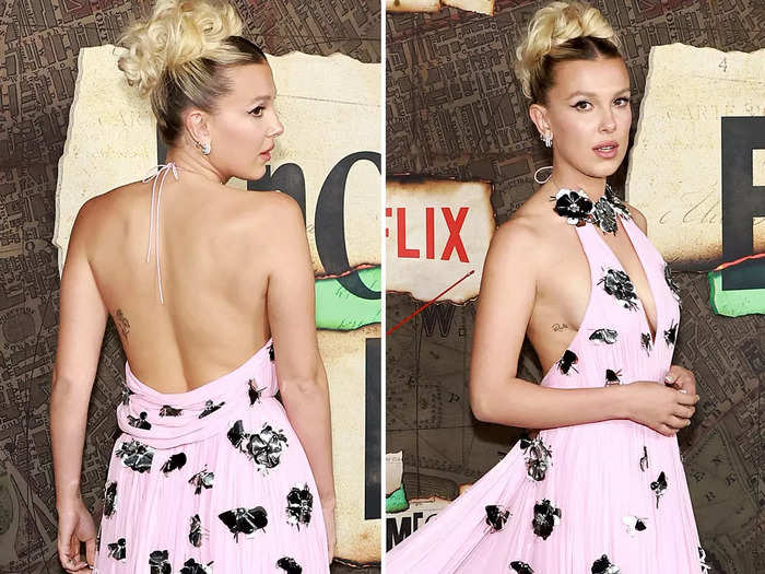 The dress was backless, which revealed her two delicate tattoos.