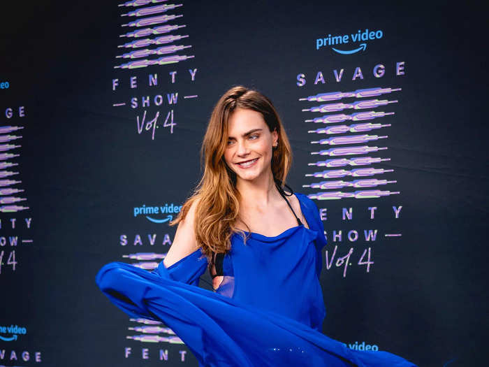 Cara Delevingne arrived at the premiere in a sheer blue dress that revealed her black underwear as she spun.