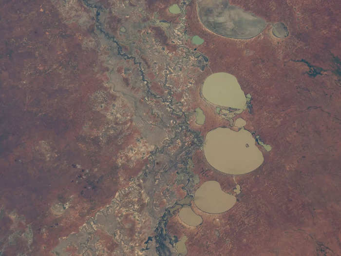 Preserved areas often feature unique natural landscapes. This national park in Australia features a river cutting through red earth and filling a series of lakes.