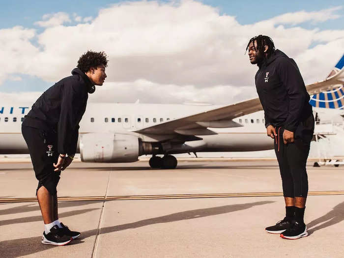 The Texas Tech players lined up opposite each other on the tarmac and ran through plays in sweatsuits and sneakers during the lengthy delay.