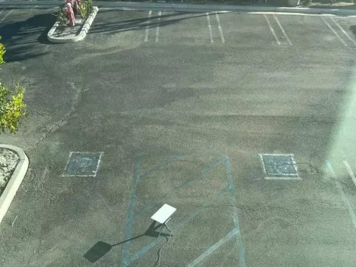 Luckily no cars were driving around when this Starlink dish was placed in the middle of a parking lot.