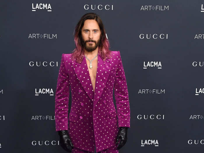 Jared Leto also wore a velvet Gucci suit but skipped the undershirt. He paired his look with leather gloves and heeled white boots.