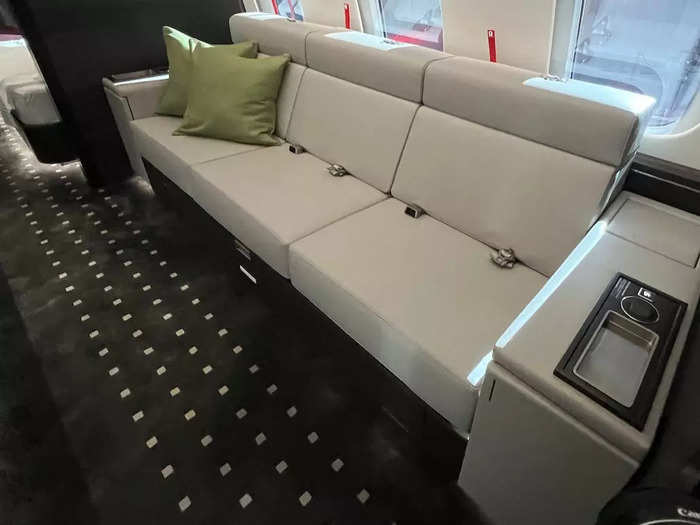 There is also a crew rest couch located beside the galley that is large enough for three people to relax.