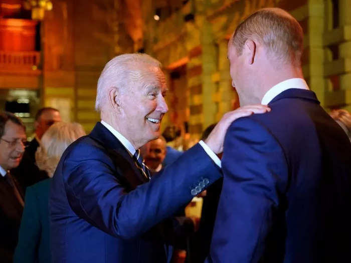 President Joe Biden eschewed traditional royal greetings and put a hand on William