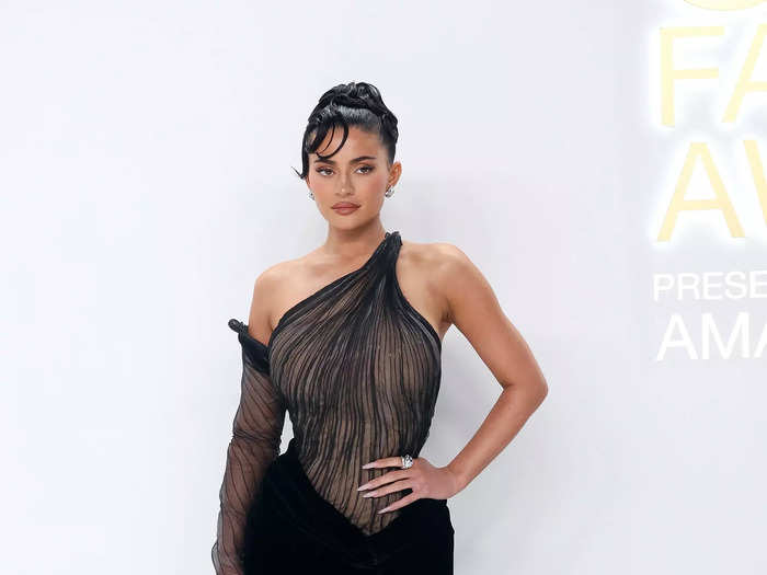 Kylie Jenner wore a 1999 Thierry Mugler gown with an off-the-shoulder sleeve and a thigh-high slit.