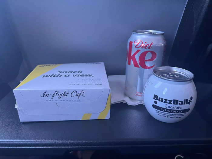 I ordered the cafe snack box, a Buzzballz Lotta Colada mixed drink, and a Diet Coke, totaling $24.