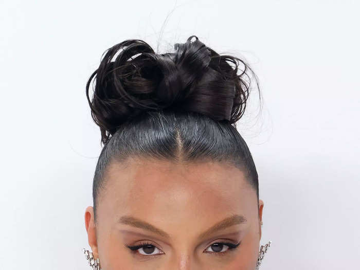 Paloma Elsesser is known for her cool-girl glam, and her bouncing top knot and graphic eyeshadow were no exception.