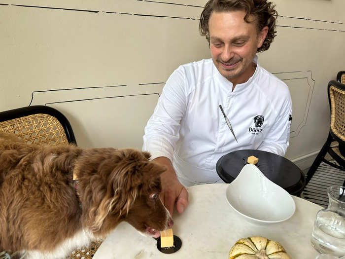 The tasting menu also comes with some off-menu surprises, much like a human tasting menu. Heidi enjoyed this bite of organic pumpkin served by Massarweh.