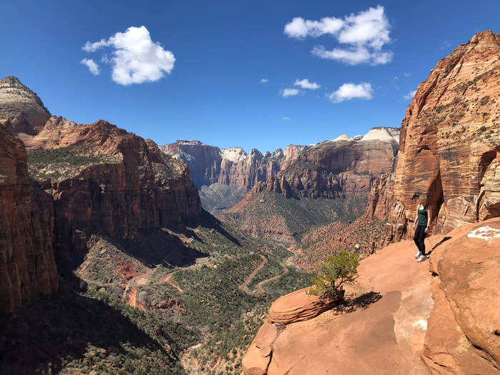 I head to Greater Zion, Utah, to hike and explore stunning red rock formations and slot canyons.