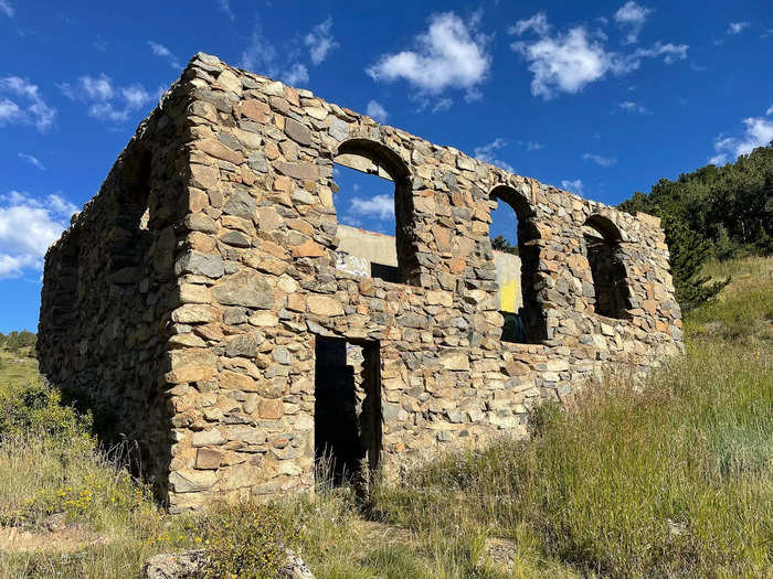 Caribou was once a silver mining town that boomed with 3,000 people, according to Western Mining History. Today, stone buildings, a wooden cabin, and a boarded-up mine entrance are all that remain.