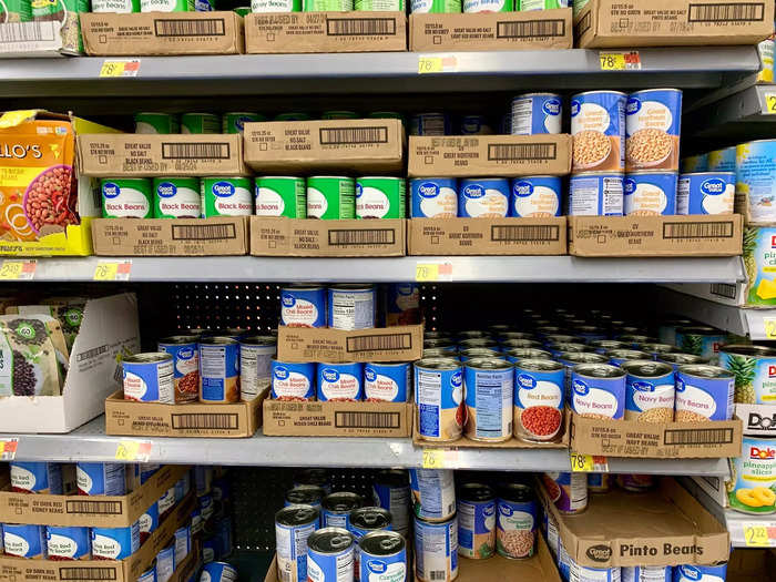 Aisles are stocked with canned goods in name and private-label brands.