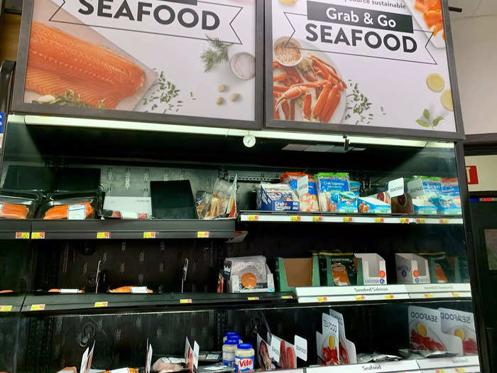 A small seafood section separates the bakery from the rest of the store, leading into the larger frozen food section.