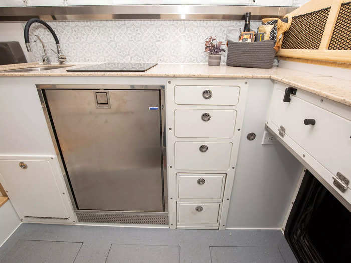 The narrower kitchen and bathroom separated the larger lofted "bedroom" and living room.