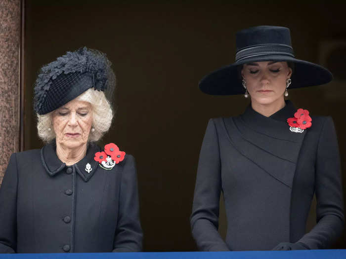 Camilla, Queen Consort, and Kate Middleton, Princess of Wales, stood side-by-side together, observing the service from the balcony of the Foreign and Commonwealth Office building.