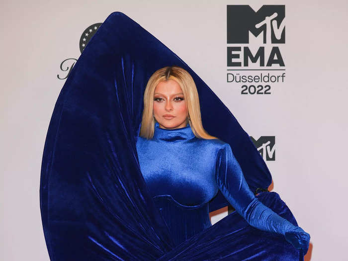 Bebe Rexha also opted for a daring red carpet look with her striking head-to-toe electric blue outfit.