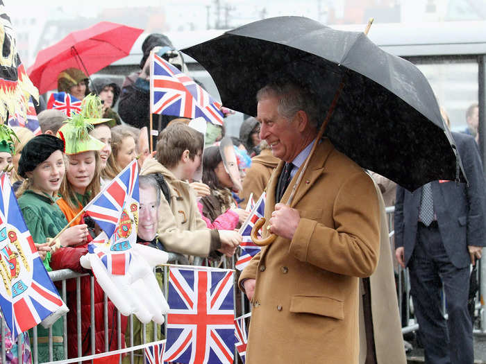 He holds his own umbrella.