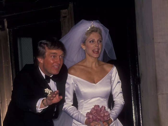 Maples wore a satin off-the-shoulder wedding dress designed by Carolina Herrera, and Trump wore a Brioni black tuxedo.