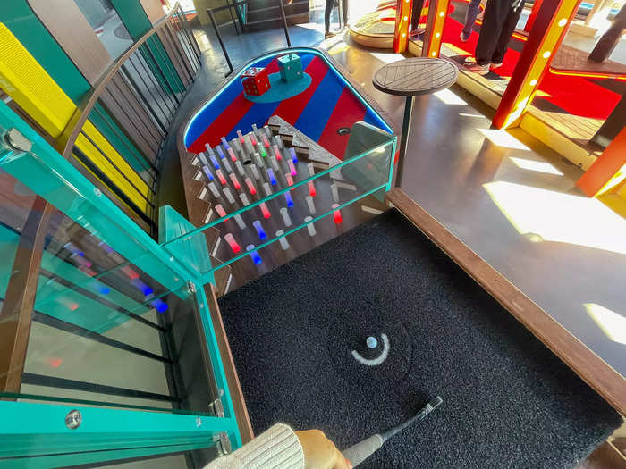 While children make their rounds on the mini golf course, parents can squeeze in a few rounds of darts.