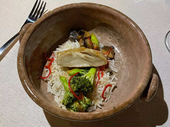 The grilled "cultivated" chicken was served atop broccoli and rice.