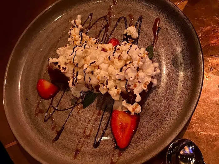 The salty popcorn balanced out the sweetness of the vegan caramel and chocolate glaze drizzled over the soft piece of bread in the plate