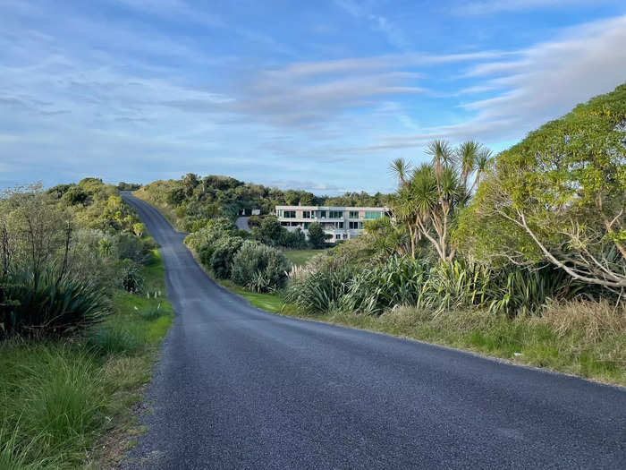 As I climbed up and through a forested area, the hiking trail led me to a freshly paved road that had a scattering of large homes.