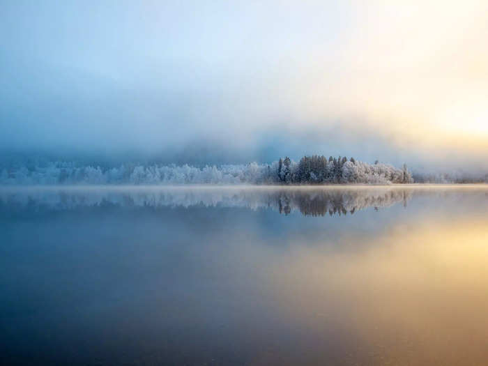 Fog also made this scene look peaceful, as the mist thinned above a glassy lake and distant snowy trees.