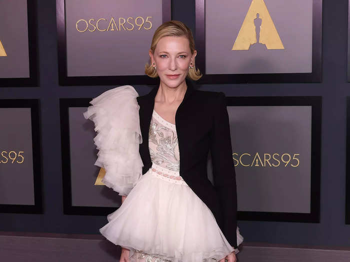 Cate Blanchett paired a dramatic gown with a structured black blazer.