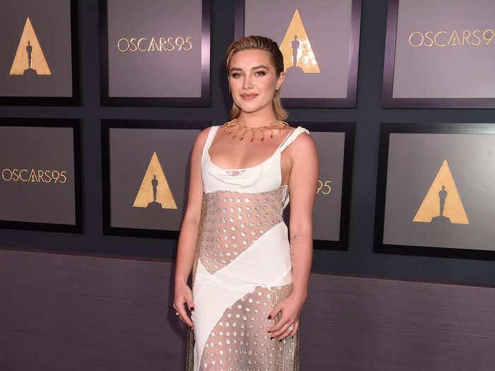 Florence Pugh wore a sheer white dress covered in gold details.