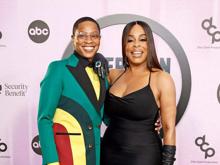 Jessica Betts and Niecy Nash walked the red carpet together. Nash wore a black fitted floor-length gown, and Betts opted for a green suit with red, yellow, and black accents.