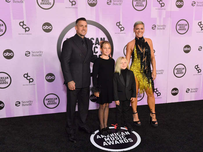 Pink wore a sequin black-and-gold dress by Bob Mackie as she posed with her husband, Carey Hart, and their children, Willow, 11, and Jameson, 5.