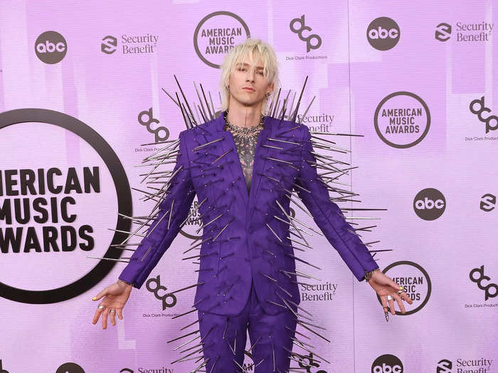 Machine Gun Kelly walked the carpet in a daring purple suit covered in spikes.