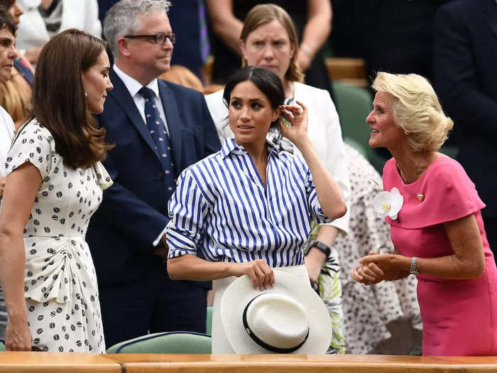 Royals have to follow strict dress codes. For example, Meghan had to remove her hat while seated in the Royal Box at Wimbledon in 2018.