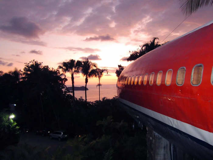 The aircraft is perched 50 feet above the ground, overlooking the Pacific Ocean…