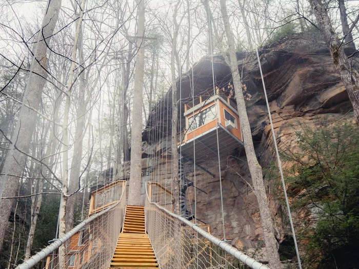 The staircase leads to another suspension bridge that takes guests up to the two treehouses