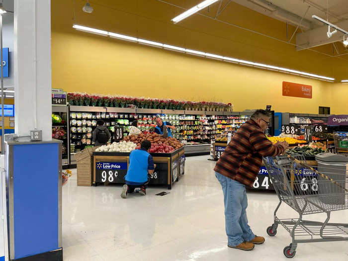 The grocery section was almost barren, occupied primarily by employees restocking inventory.